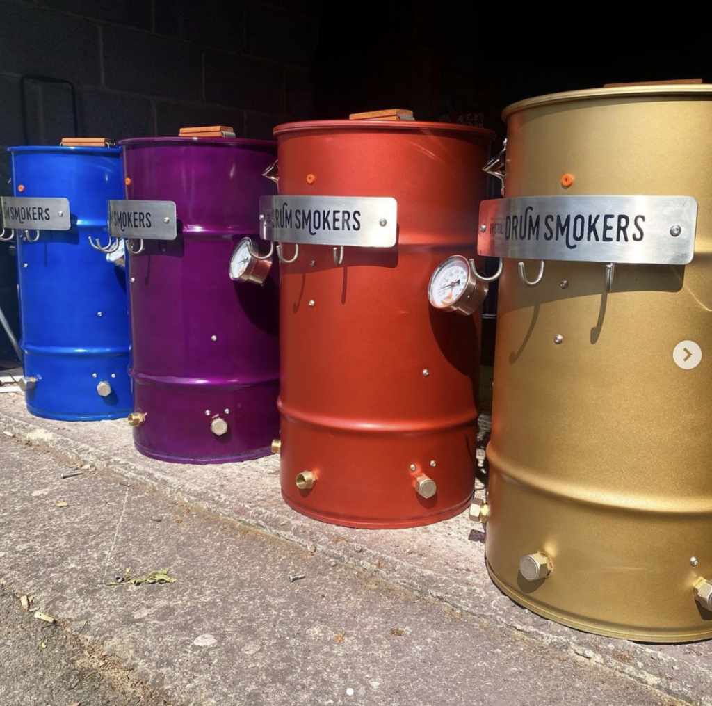 Colorful Ugly Drum Smokers (UDS) from Bristol Drum Smokers.